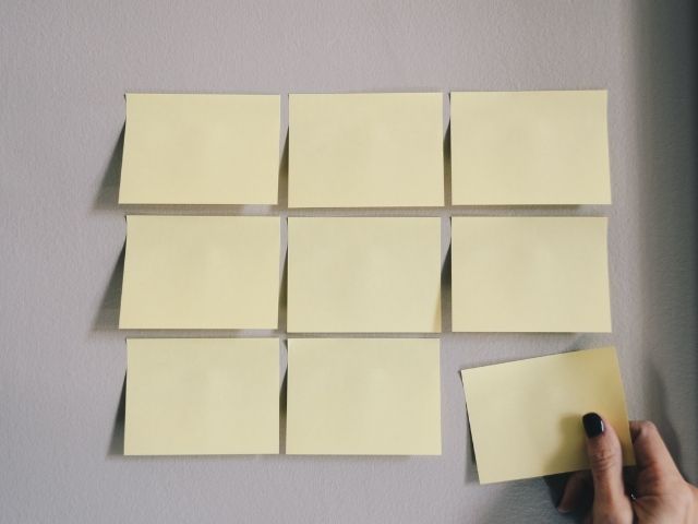 Laying out priorities in early recovery on sticky notes.