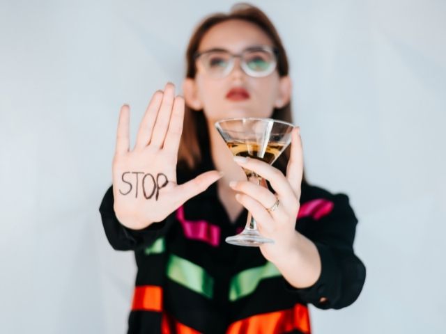 A woman attempting to stop drinking alcohol.