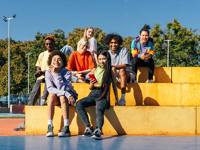 Sober, recovering teenagers posing on some steps.