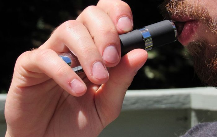 A THC user who is relapsing using a vape.